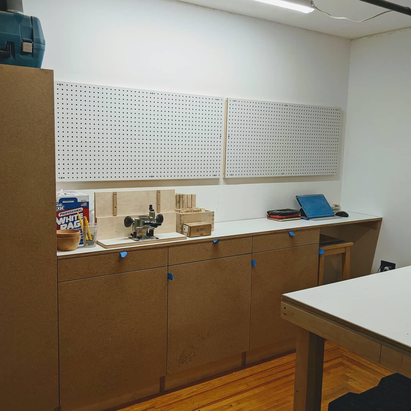 October 26th, 2020: Tonight we hung up a couple of pegboards to help organize our tools. Slowly but surely, our studio is coming together!